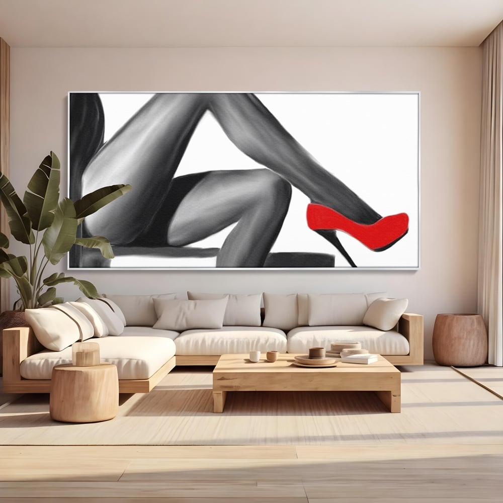 Tablou canvas cu illustratie alb negru cu picioare si pantof rosu, in rama de aluminiu argintiu, pe perete intr-un living